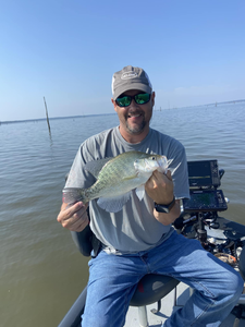 A lone angler fishing in the Mississippi River
