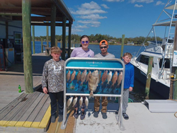 4 people fishing on a beautiful day at Panama City Beach