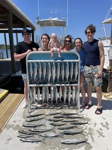 Group of 7 people fishing on the beach in Panama City Beach