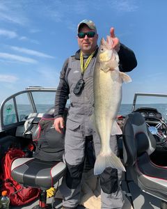Angler holding a medium-sized fish in Michigan
