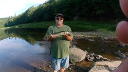 Angler casting line in Pennsylvania river