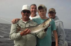 Four people enjoying a fishing trip in Crawfordville