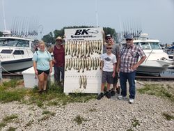 Five people enjoying a lakeside fishing trip at Lakeside Marblehead