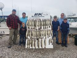 Six people enjoying a lakeside fishing trip at Lakeside Marblehead