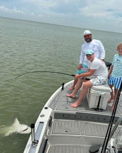 A group of 3 people fishing in Goodland