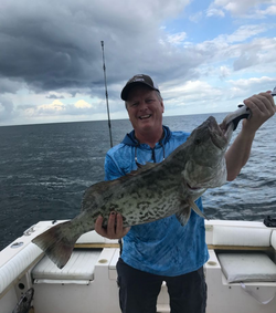 A fisherman with a large Gag Grouper catch in Pensacola