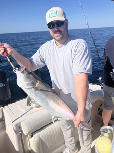 Reeling in a big one out on the open waters.
