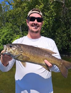 A fisherman in West Virginia with a 24-inch catch