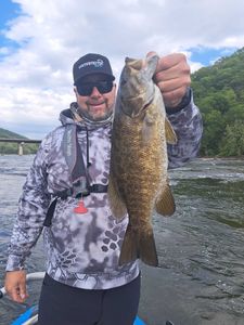 A person fishing in Harpers Ferry