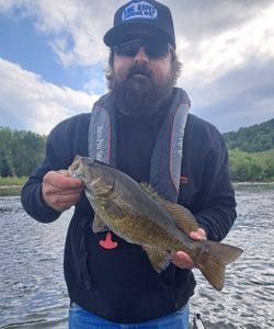 A lone fisherman casting a line in West Virginia