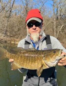 A single fisherman holding a fishing rod in West Virginia