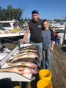 Two anglers enjoying their catch in Erie