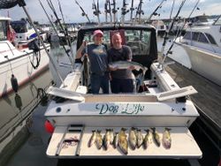 2 anglers fishing in Erie, holding a big fish