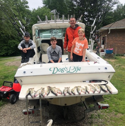 Four people enjoying a fishing trip in Erie