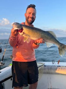 Angler holding a large walleye fish in PA