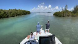 Two people enjoying a fishing trip in Placida