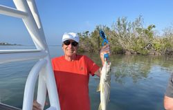 An angler enjoying a fishing trip in Placida