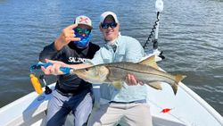 Snook fish caught by two people in FL