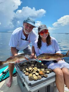 Two anglers with 2 small fish caught in Citrus County