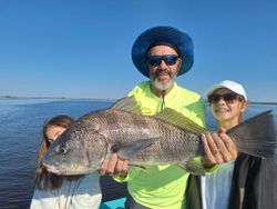 Photograph of a 23-inch black drum fish caught while fishing in FL