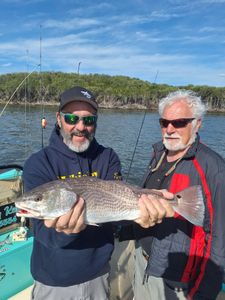 Two anglers with a 23-inch fish caught in Citrus County