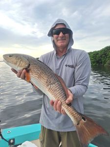One fisherman reeling in a 26-inch catch in FL
