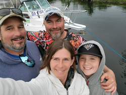 Four people fishing on a cruises and fishing trip in Connelly