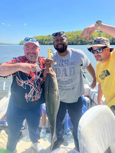 Three people fishing on a cruises and fishing excursion in Connelly