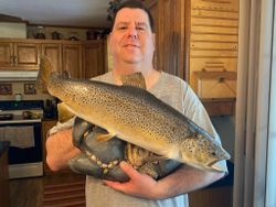 Angler proudly holding a 21-inch catch in WI