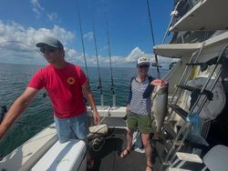 A pair of anglers fishing for a lake trout in Superior