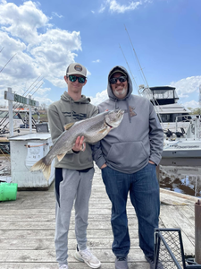 Anglers with a big fish in Superior