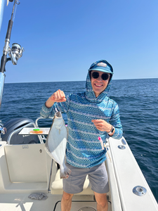 Nice catch using deep sea jigging techniques in partly cloudy conditions!