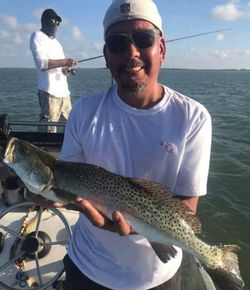A lone brook trout caught while fishing in South Padre Island