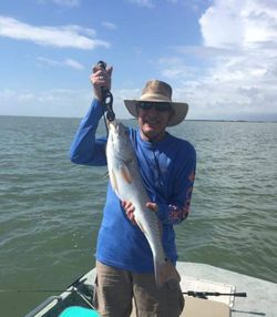 Two people fishing in TX