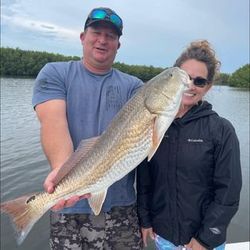 Two anglers fishing in Florida with a big fish catch