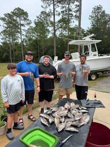5 people enjoying a cruises and fishing trip in FL