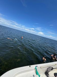 A person fishing from a boat in Florida