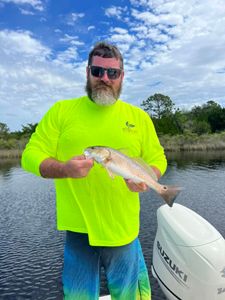 A person fishing in Carrabelle, Florida