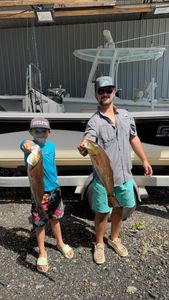 Two redfish, 20-inch fish caught during cruises and fishing in Carrabelle