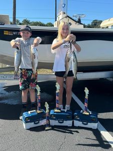 Three spotted weakfish and redfish caught during a fishing trip in Carrabelle