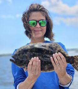 A person fishing in the waters of SC