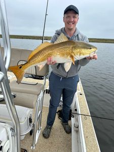 Angler with redfish in LA