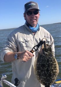 Photograph of a Southern Flounder measuring 15 inches, caught while fishing in Port Aransas