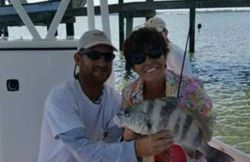 Two people fishing in the waters of FL