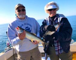 Two anglers with their catch of 15-inch fish in Knife River