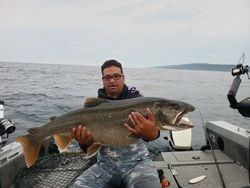 Photograph of a rainbow trout, a 38-inch fish caught while cruising and fishing in MN.