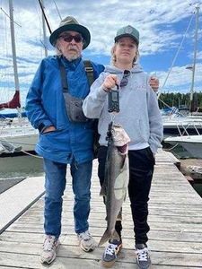 Two people enjoying a fishing cruise in Minnesota