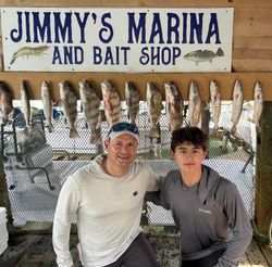 14 black drum fish caught by two people in Port Isabel