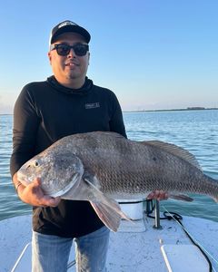 Angler with a black drum fish caught in Port Isabel