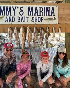Fishing charter catch display showing redfish and other species at Port Isabel TX marina